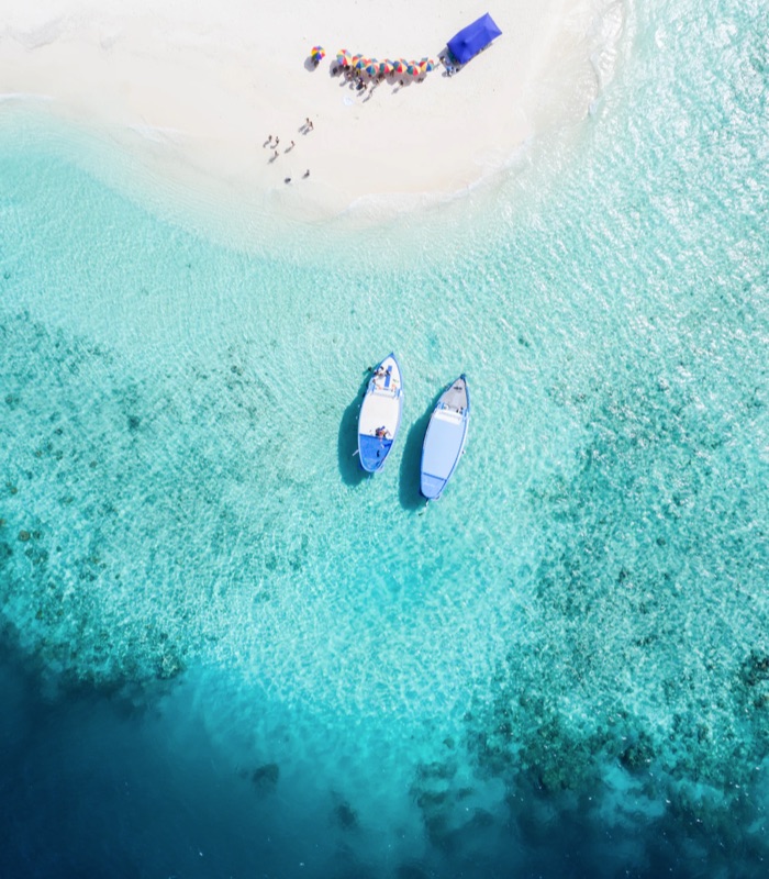 Aerial view of a tropical shore with boats